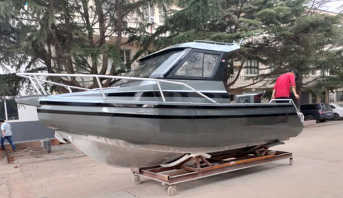 Barco de motor de pesca-paseo fueraborda - LEADER 588 - Qingdao Allheart Marine Co., Ltd. - con caseta de timón / 6 personas máx. / para cubierta de teca