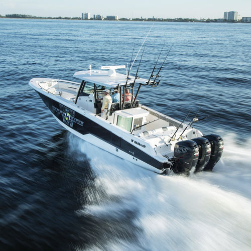 Barco open fueraborda - 352 FISHERMAN - Wellcraft - trimotor / con consola central / con fly