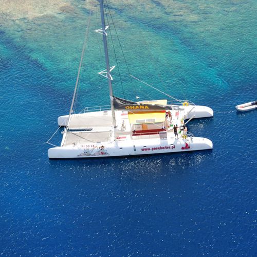 Yate de vela catamarán - 64' - Ocean Voyager - con popa abierta / con deck saloon / de fibra de vidrio